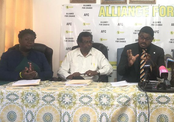 Alliance for Change (AFC) Chairman Khemraj Ramjattan (at centre) with candidates Amaniah Cort and Trevon Chichester last Wednesday