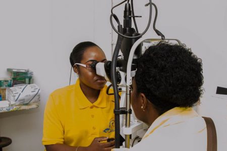 Ophthalmologist of the Georgetown Public Hospital Corporation (GPHC), Dr. Arlene Bobb-Semple screening a patient yesterday at the Eye Clinic (Department of Public Information photo)