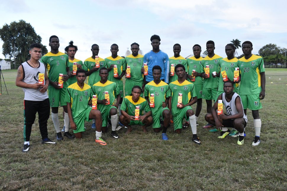 Members of the Golden Jaguars U-20 side displaying the supplements donated by the New Guyana Pharmaceutical Corporation (GPC) to aid in their preparation for the CONCACAF U-20 Championship.