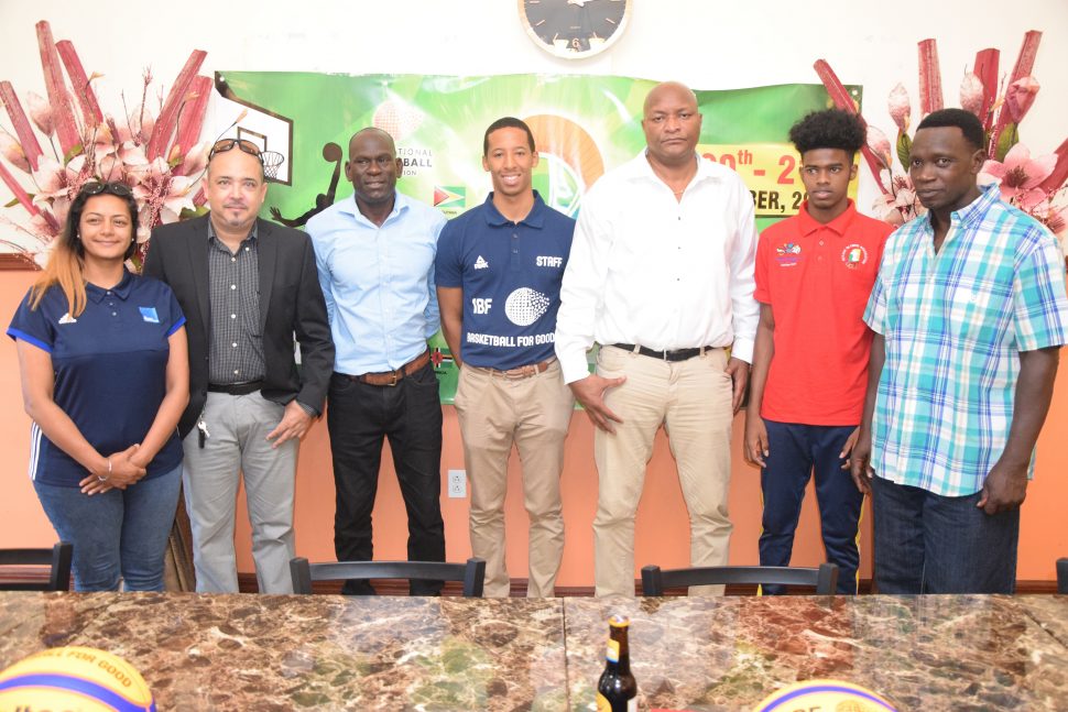 GABF President Nigel Hinds (3rd from right) and IBF representative Theren Bullock (centre) posing with members of the launch party for the IBF Under-18 Antilles 3x3 Championships. Also in the photo are Guyana Boys Coordinator Mark Agard (right), Guyanese player Shamar France (2nd from right), GBOC President Dexter Douglas (3rd from left), GABF Vice-President Michael Singh (2nd from left) and Change Foundation representative Navjeet Sira.