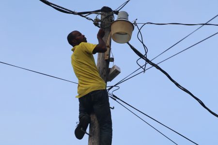 NDC worker Andrew Springer fixes a street light in Sparendaam