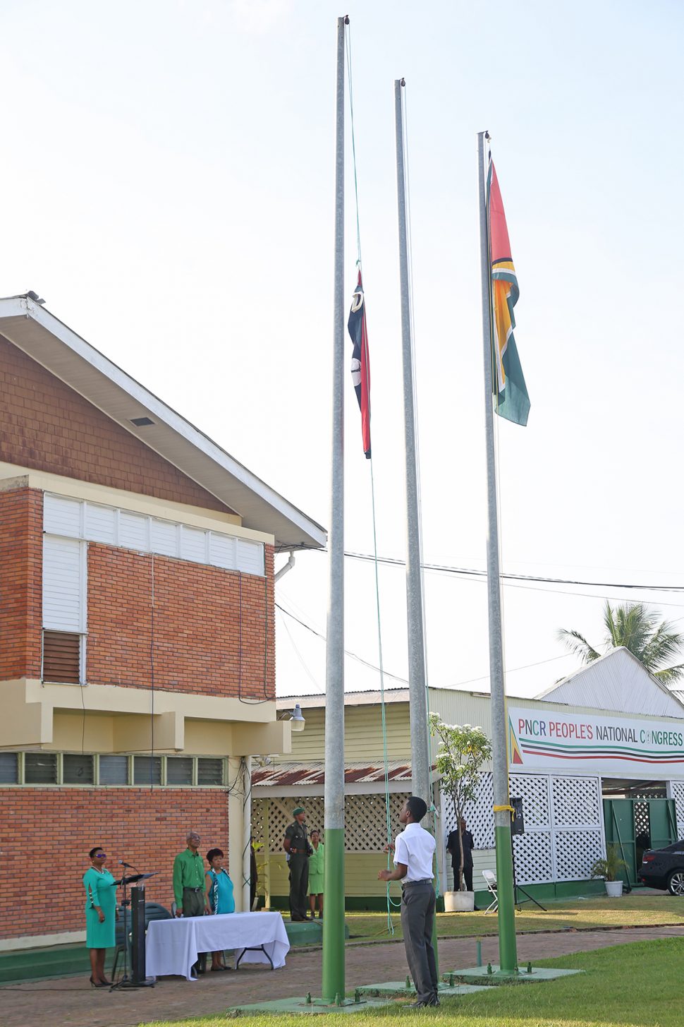 The flag being hoisted to mark the 61st anniversary of the formation of the PNCR. The flag raising ceremony was held at Congress Place, Sophia (Terrence Thompson photo)