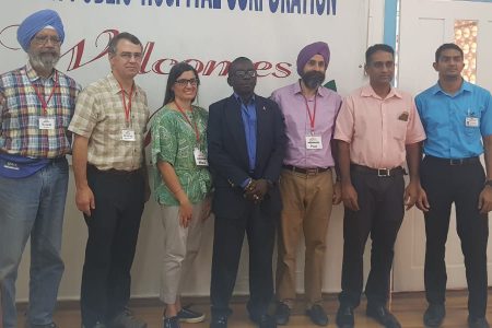 From right, Dr Khaleshwar Ramcharran;  Head of GPHC’s Orthopaedic Department, Dr David Samaroo; Operation Walk Founder Dr Paul Khanuja; CEO of the GPHC, Brigadier (ret’d) George Lewis; Co- founder Maria Khanuja; Charles Roland, Chief Operations of Bay View Medical Hospital and John Hopkins Hospital; and Dr Garpal Bhuller, volunteer surgeon.