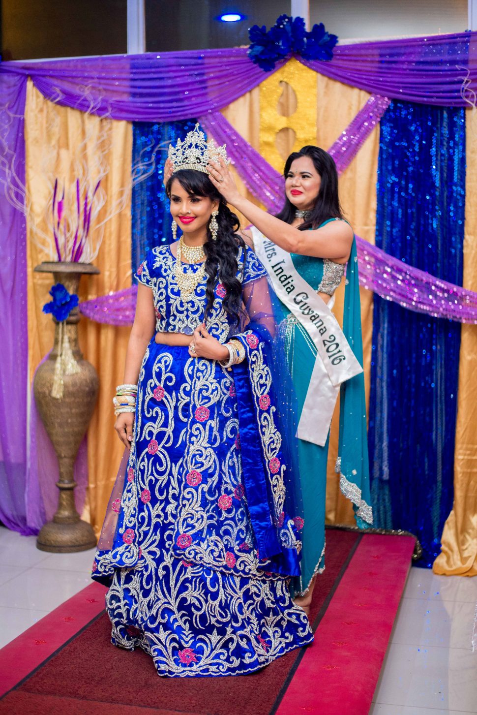 Shivanie Latchman being crowned the new Mrs India Guyana by Mrs. India Guyana 2016 Samantha Singh. Photos taken by photographer – Saajid Husani
