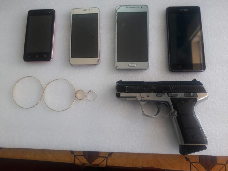 The recovered phones and jewellery that were stolen during an attack on a Zeelugt, East Bank Essequibo couple on Friday evening. Also in photo is the handgun allegedly brandished by Noel “Kevin” Kissoon during a fatal confrontation with police outside of his home yesterday morning. 