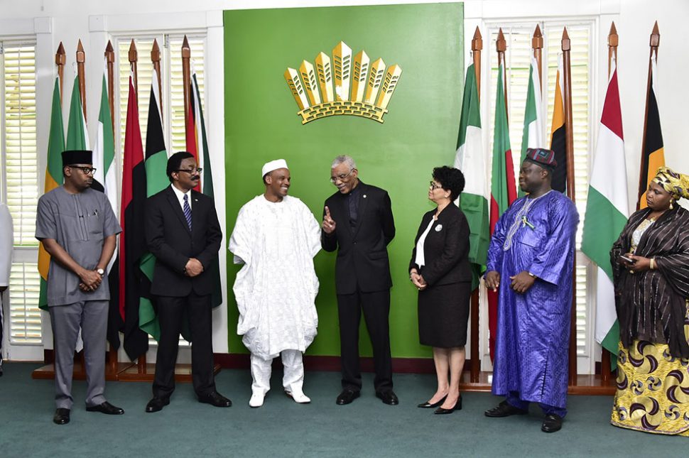 President David Granger (centre) shares a light moment with the new Nigerian High Commissioner to Guyana, Alhaji Hassan Jika Ardo (third from left) as Attorney General, Basil Williams (second from left),  Director General of the Ministry of Foreign Affairs, Audrey Waddell (third from right) and other members of the Nigerian delegation look on. (Ministry of the Presidency photo)