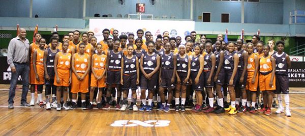 Nigel Hinds, President of the GABF, poses for a photo with the different teams during the opening ceremony of the IBF Under-18 Antilles 3×3 Championships yesterday at the Cliff Anderson Sports Hall.
