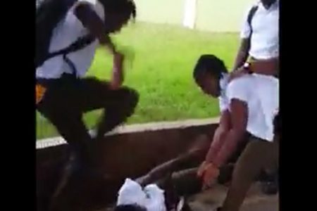 A screenshot from the video showing the brutal beating of a pupil.
