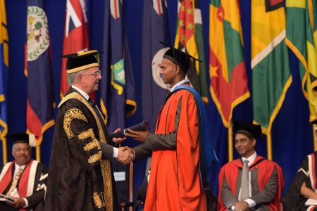 Dr ‘Tiger’: Shivnarine Chanderpaul (right) receiving his honorary doctorate. (Photo from UWI St Augustine Facebook page)