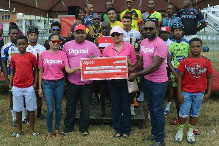 The top prize winners along with representatives of Digicel and the Guyana Cancer Institute pose for a photo opportunity yesterday following the seventh Digicel Cycling event staged on the circuit outside the GDF compound on Irving Street and Vlissingen Road. (Orlando Charles photo)
