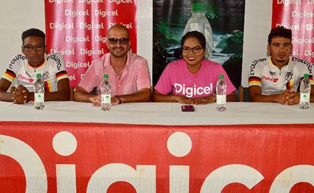 The stakeholders along with some Team Evolution cyclists pose for a photo following the launch of the seventh annual Digicel Cancer Awareness cycling event.
