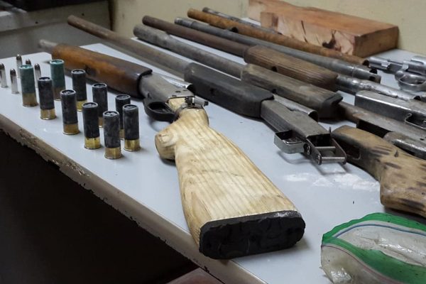 Some of the shotguns and ammunition found by North Eastern Division Task Force officers during a raid yesterday.