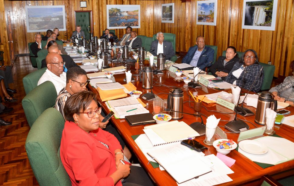 President David Granger (fifth from right) and his Cabinet fully engaged as a delegation from the Estonian e-Governance Academy presents the draft report on the project, Digital Governance Roadmap for the Government of Guyana. (Ministry of the Presidency photo)
 