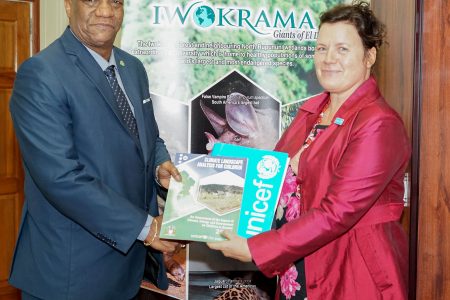 Minister of State, Joseph Harmon (left), yesterday, received the first Climate Landscape Analysis for Children (CLAC) to be presented in the South American Region from the United Nations Children’s Fund (UNICEF).The Department of Public Information said that the report which was presented by UNICEF’s Representative to Guyana, Sylvie Fouet, is an assessment of the impact climate, energy and the environment have on Guyanese children.Fouet said environmental awareness among youth is very important and she hopes that there would be continued consultations with the youth on the subject.“What I like the most is that we have been supported by the Office of Climate Change (OCC) and more than twenty-one agencies in Guyana opened their doors [to us] ... so it is a very comprehensive review, “ Fouet said of the analysis while committing to strengthening UNICEF’s relationship with the OCC and other stakeholders. (DPI photo)