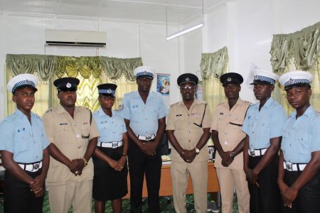 Standing fourth from the right is Traffic Chief, Superintendent Linden Isles, third from the right Deputy Superintendent Dennis Stephen, second from the left Inspector Raun Clarke, Corporal Kenny Bishop and other ranks from the department. (Guyana Police Force photo) 
