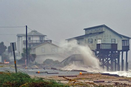 Waves crash on stilt houses along the shore due to Hurricane Michael at Alligator Point in Franklin County, Florida, U.S., October 10, 2018.  REUTERS/Steve Nesius