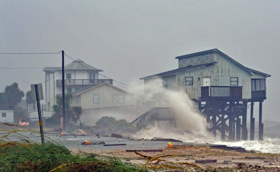 Waves crash on stilt houses along the shore due to Hurricane Michael at Alligator Point in Franklin County, Florida, U.S., October 10, 2018.  REUTERS/Steve Nesius