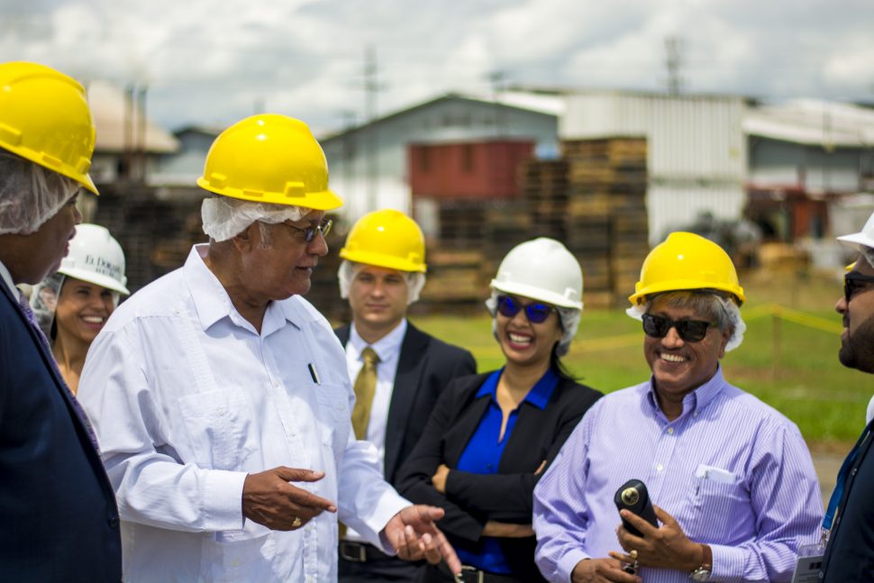 Agriculture Minister Noel Holder (second from left) and DDL Chairman Komal Samaroo (second from right) during the visit. 