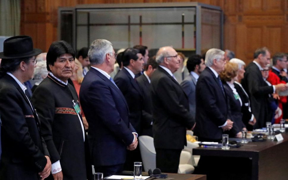 Bolivian President Evo Morales (left) is seen at the International Cpourt of Justice, the U.N.’s highest court for disputes between states, before the ruling on a dispute between Bolivia and neighbour Chile on access to the Pacific Ocean, in The Hague, the Netherlands October 1, 2018.   REUTERS/Yves Herman