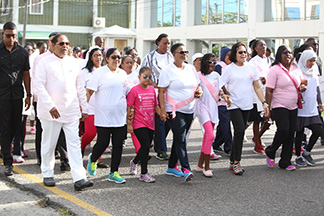 Prime Minister Moses Nagamootoo, his wife Sita Nagamootoo, Minister of Public Health Volda Lawrence, First Lady Sandra Granger and Minister within the Ministry of Public Health Dr. Karen Cummings along with two young participants of the breast cancer awareness walk. (DPI photo)