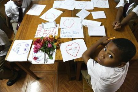 Grade one students of  Hastings Academy in Clarendon wrote notes in memory of their deceased class mate, six-year-old Dajone Pennant, who drowned in the Mount Claire area in May Pen, Clarendon on Monday evening, following  heavy rains.