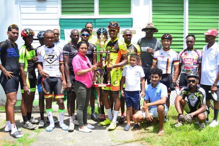 The top prize winners pose for a photo following the seventh annual Kadir Mohamed ‘Ounce of Gold’ road race yesterday on Homestretch Avenue. (Orlando Charles photo)
