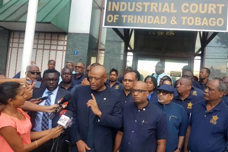 President of the Oilfields Workers Trade Union (OWTU), Ancel Roget, address members of the media outside the Industrial Court where a decision was made restraining Petrotrin from terminating its workers, following an injunction by the court yesterday. (Trinidad Express photo)
