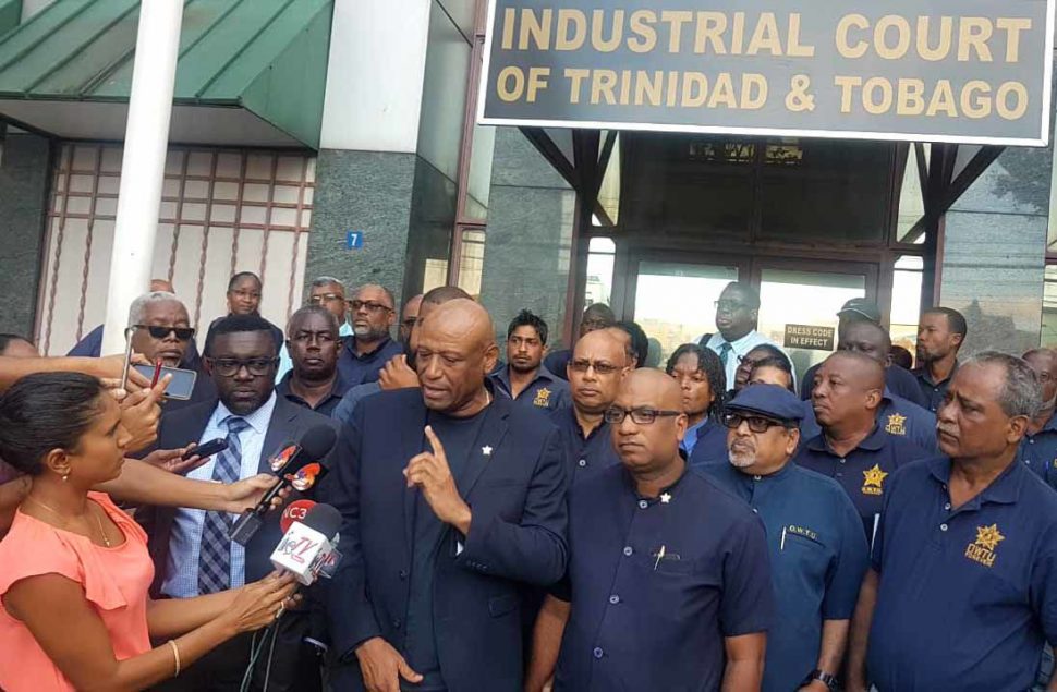 President of the Oilfields Workers Trade Union (OWTU), Ancel Roget, address members of the media outside the Industrial Court where a decision was made restraining Petrotrin from terminating its workers, following an injunction by the court yesterday. (Trinidad Express photo)