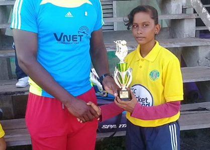 Lavina Ragobeer receives her award from Essequibo coach Ryan Hercules.
