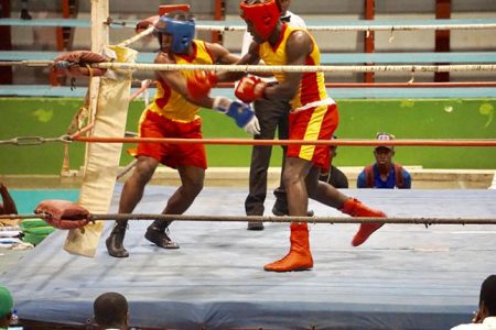 Middleweight, Royden Grant pummels opponent, Corlette Greenidge with a right hand. Grant was one of several boxers who recorded wins on opening night of the Blackmore Intermediate Championships at the National Gymnasium on Friday.
