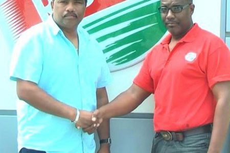 GFSCA’s Anil Beharry (left) and another official with the Rubis representative (Photo name: Rubis)
