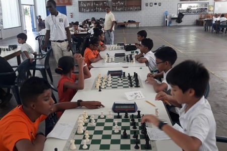 Tense action unfolded on Sunday at the Marian Academy Scholastic Chess Club Competition.
