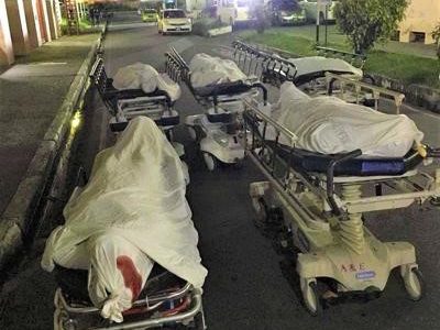 The bodies of the five dead men, before being taken to the mortuary of the Port of Spain general Hospital.