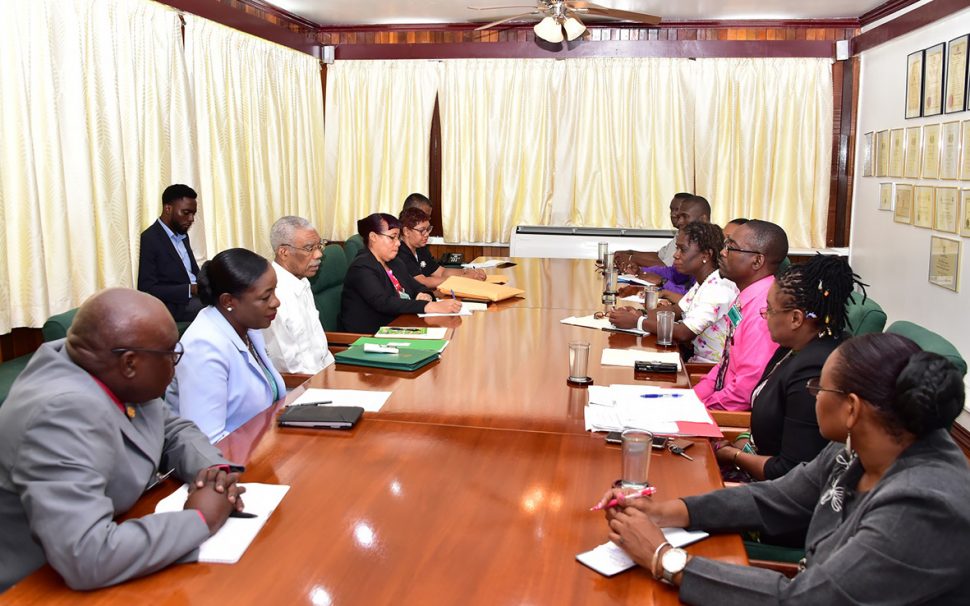President David Granger with Ministry of Education officials (at left) during the meeting with executive members of the Guyana Teachers’ Union at State House during a meeting on Monday morning. (Ministry of the Presidency photo)