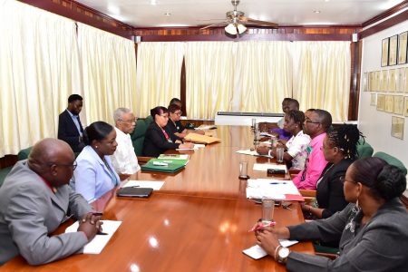 President David Granger with Ministry of Education officials (at left) during the meeting with executive members of the Guyana Teachers' Union at State House this morning