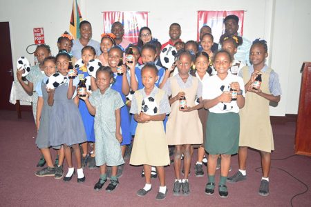 Members of the several of the competing teams pose for a photo opportunity following the launch of the fifth Girls Pee Wee Primary School Football Championships.
