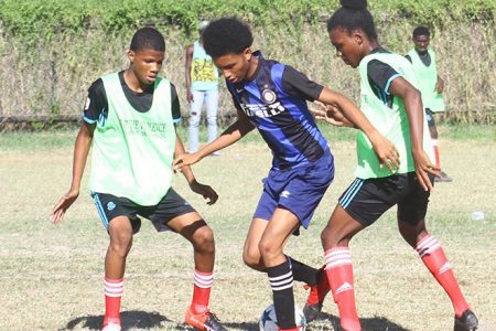 Action  between Lodge Secondary and Uitvlugt Secondary at the Ministry of  Education ground,  Carifesta Avenue in the Guyoil/Tradewind Tankers  U18 Secondary Schools Football Championship