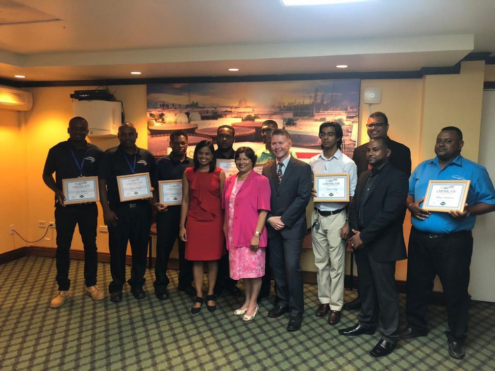 High Commissioner of Canada to Guyana Lilian Chatterjee (middle) along with CEO of Safework Solutions Jeff Daniels (third from right front row) and Dr. Surendra Persaud right in the back row) along with the graduating students last evening. 