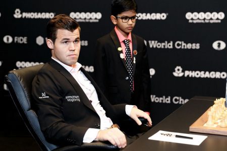 World chess champion Magnus Carlsen with the 9-year-old Indian-origin chess prodigy Shreyas Royal, who was given the significant honour of making one of the first moves of the 2018 Carlsen-Caruana world championship chess match. He is ranked No 4 in the chess world within his age group. Royal won an immigration contest to remain in the UK recently, and played in the 2018 British Chess Championship. He has been described as a “national asset” by British newspaper, The Guardian. (Photo: Nikolai Dunaevsky/World Chess)
