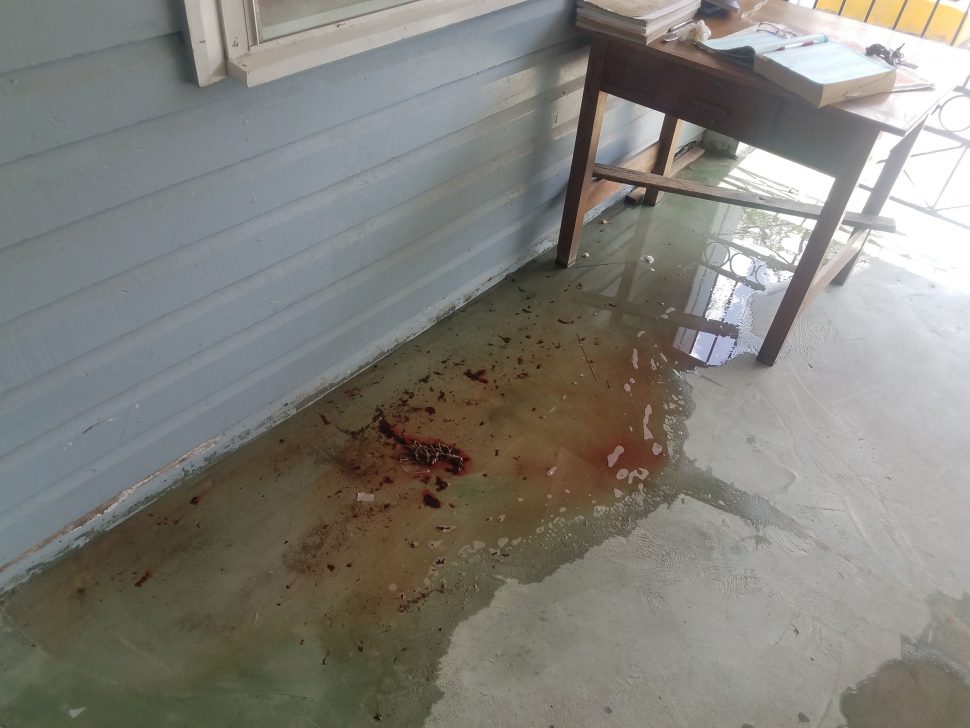 Some of the blood which was being washed away by the cleaners after police came to the scene. 