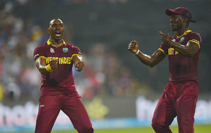 FLASHBACK: Dwayne Bravo (left) and then captain Darren Sammy celebrate West Indies’ capture of the 2016 T20 World Cup. 