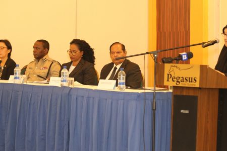 DPP Shalimar Ali-Hack addressing the launch. Seated (from right) are Prime Minister Moses Nagamootoo, acting Chancellor of the Judiciary Yonette Cummings-Edwards, Deputy Commissioner of Police Paul Williams and United Nations Representative Mikiko Tanaka.  (Photo by Terrence Thompson)