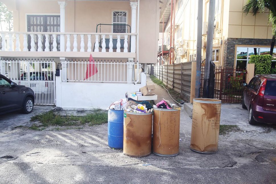 Overflowing garbage bins sit on the road in front of an East Street residence waiting to be emptied as a result of the disruption in collection that has resulted due to the two main contractors suspending their services over non-payment. 