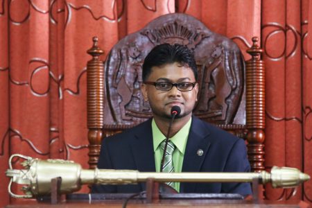  Mayor-elect Ubraj Narine takes his seat at the head of the horseshoe-shaped table in the council chamber.  (Photo by Terrence Thompson)
