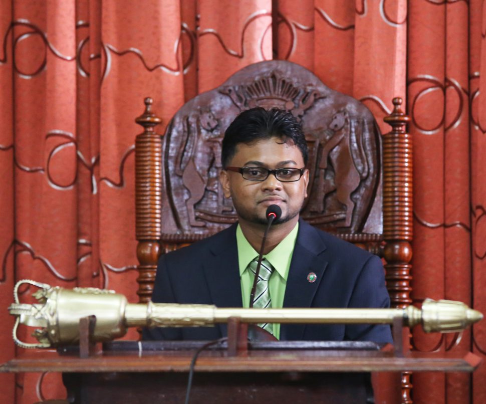  Mayor-elect Ubraj Narine takes his seat at the head of the horseshoe-shaped table in the council chamber.  (Photo by Terrence Thompson)
