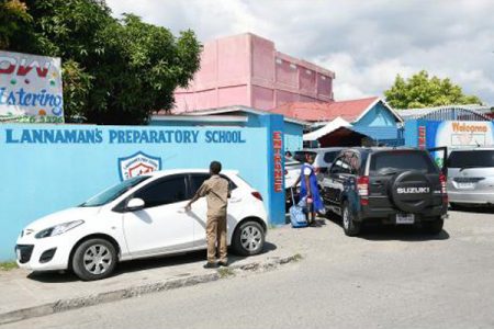 Parents collected their children early at Lannaman’s Preparatory School in St Andrew as the school suspended classes for the day after a parent was killed after dropping off his child yesterday morning.