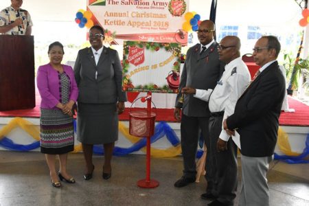 Minister of Public Affairs Dawn Hastings-Williams (left) with Salvation Army officials and Chairman of the Salvation Army Advisory Board Edward Boyer (at right) at the launch of the annual ‘Christmas Kettle’ appeal at the Georgetown Club. (Department of Public Information photo)