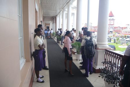Some of the students who turned up  at Parliament on Friday only to be told that there would be no sitting as the government was meeting with its MPs. (Terrence Thompson photo)