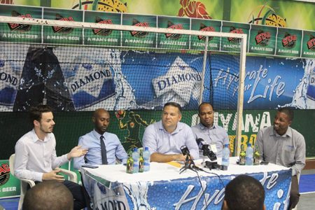 ExxonMobil Communications Director Nicholas Yearwood [left], making a point at the launch of the 14th Annual Diamond Mineral Water Hockey Festival. Also in the photo from left to right are Diamond Mineral Water Brand Manager Larry Wills, GHB President Phillip Fernandes, Stag Beer Brand Coordinator Nigel Worrell and former national player Devin Hooper 