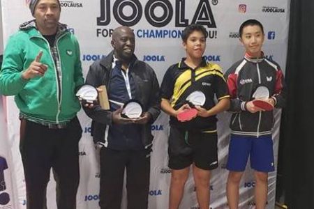  Guyanese Jonathan Van Lange (second from right) with his silverware after a successful outing in this year’s Joola Table Tennis Tournament in USA 